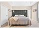 This lovely main bedroom has a tray ceiling, sconces, and private bathroom access at 33316 Irongate Dr, Leesburg, FL 34748