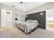 Relaxing main bedroom boasts a tray ceiling, stylish sconces, and a private bathroom with a tub at 33316 Irongate Dr, Leesburg, FL 34748