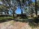 Spacious backyard with mature trees offering shade and privacy at 35219 Haines Creek Rd, Leesburg, FL 34788