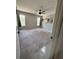 Spacious bedroom with two windows, neutral carpet, and ceiling fan providing ample light and comfort at 35219 Haines Creek Rd, Leesburg, FL 34788