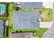 Birds eye view of the home displaying the roof, landscaping, and the surrounding lawn at 3566 Gentle Ter, The Villages, FL 32163