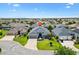Aerial view showcasing the home's location within a well-planned community, surrounded by lush greenery at 3566 Gentle Ter, The Villages, FL 32163