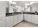Bathroom featuring dual sinks, ample cabinetry, and a sleek, modern design at 3566 Gentle Ter, The Villages, FL 32163