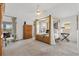 Spacious bedroom featuring a four-poster bed, ceiling fan and natural light at 3566 Gentle Ter, The Villages, FL 32163