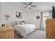 Bright bedroom with a ceiling fan, white walls, a carpeted floor, and a charming decor at 3566 Gentle Ter, The Villages, FL 32163