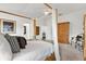 Beautiful bedroom with a four-poster bed, plush carpet and luxurious decor at 3566 Gentle Ter, The Villages, FL 32163