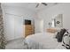 Cozy bedroom offering white walls, a ceiling fan, carpeted floor and double door closet at 3566 Gentle Ter, The Villages, FL 32163