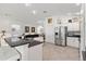 Modern kitchen design featuring stainless steel appliances, granite countertops, and tile flooring at 3566 Gentle Ter, The Villages, FL 32163