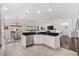 Kitchen featuring stainless steel appliances, granite countertops, and bar seating overlooking the living area at 3566 Gentle Ter, The Villages, FL 32163