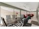 Enclosed lanai with outdoor dining and seating areas, offering a relaxing retreat at 3566 Gentle Ter, The Villages, FL 32163