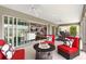 Inviting lanai featuring a fire pit and comfortable seating, perfect for outdoor relaxation and entertainment at 3566 Gentle Ter, The Villages, FL 32163