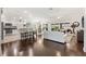 Bright living space featuring a modern kitchen, dining area, and cozy seating arrangement at 3566 Gentle Ter, The Villages, FL 32163