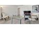 Bright office with a glass desk, neutral walls, carpet and comfortable seating for a productive work environment at 3566 Gentle Ter, The Villages, FL 32163