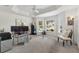 Spacious office with a tray ceiling, large windows, carpeted floors, and an executive desk at 3566 Gentle Ter, The Villages, FL 32163