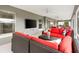Screened-in patio area with ceiling fans, outdoor furniture, and a mounted television for outdoor enjoyment at 3566 Gentle Ter, The Villages, FL 32163