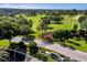 Scenic aerial view of the Kings Ridge community entrance and golf course at 3586 Eversholt St, Clermont, FL 34711