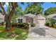 Charming single-story home with well-maintained landscaping, mature trees, and a cozy, inviting curb appeal at 3586 Eversholt St, Clermont, FL 34711