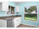 Bright kitchen featuring stainless steel appliances, granite counters, and a functional layout at 3586 Eversholt St, Clermont, FL 34711