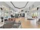Bright lobby with hardwood floors, stylish furniture, and large windows offering ample natural light at 3586 Eversholt St, Clermont, FL 34711