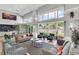 Spacious lounge area with comfortable seating, large windows overlooking the pool, and stylish decor at 3586 Eversholt St, Clermont, FL 34711