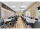 Large meeting room with tables, chairs, storage cabinets, and plenty of natural light at 3586 Eversholt St, Clermont, FL 34711