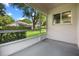 Enclosed porch offering views of the home's backyard and landscaped surroundings at 3586 Eversholt St, Clermont, FL 34711
