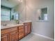 Bathroom showcasing double sinks with granite countertops and modern fixtures at 359 Blue Branch St, Eustis, FL 32736