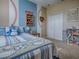 Comfortable bedroom with baseball-themed decor, closet, and natural light at 359 Blue Branch St, Eustis, FL 32736