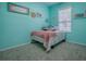 Cozy bedroom decorated with personalized decor and a large window at 359 Blue Branch St, Eustis, FL 32736