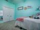 Bright bedroom showing ample storage space, light-blue colored walls, and plush carpet at 359 Blue Branch St, Eustis, FL 32736
