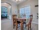 Dining room with a wood table, chairs, and an arched window that provides natural light at 359 Blue Branch St, Eustis, FL 32736
