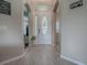 Bright foyer with wood-look floors and an ornate front door at 359 Blue Branch St, Eustis, FL 32736