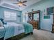 Charming main bedroom displaying a dresser with a mirror and outdoor access at 359 Blue Branch St, Eustis, FL 32736