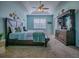 Bright main bedroom boasting a tray ceiling and comfortable furnishings at 359 Blue Branch St, Eustis, FL 32736