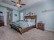 Spacious main bedroom featuring a tray ceiling, wood accents, and ample natural light at 359 Blue Branch St, Eustis, FL 32736