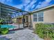 Screened-in pool area features backyard access and ample sunlight for leisure at 359 Blue Branch St, Eustis, FL 32736