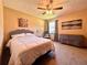 Bright bedroom featuring soft carpet, neutral walls, and a ceiling fan at 3664 Se 45Th Pl, Ocala, FL 34480