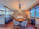 Open dining area boasts a round table with seating for four and flows into the kitchen at 3664 Se 45Th Pl, Ocala, FL 34480