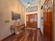 Elegant foyer with hardwood floors, a decorative console table, and a stylish light fixture at 3664 Se 45Th Pl, Ocala, FL 34480