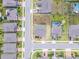 A high-definition aerial photo of a home showcasing its lot's shape and position within a residential neighborhood at 391 Cheeota Ct, Minneola, FL 34715