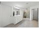 Bathroom featuring tiled flooring, walk-in shower with bench and spacious vanity at 391 Cheeota Ct, Minneola, FL 34715