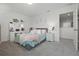 Cozy bedroom featuring plush carpet, decorative accents, and a comfortable bed at 391 Cheeota Ct, Minneola, FL 34715