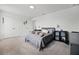 Bedroom with plush carpet features a comfortable bed, closet and a ceiling light at 391 Cheeota Ct, Minneola, FL 34715