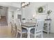 Bright dining room features a large dining table, decor, and staircase access at 391 Cheeota Ct, Minneola, FL 34715