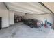 Spacious two car garage with multiple vehicles and ample storage space at 391 Cheeota Ct, Minneola, FL 34715