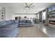 Spacious open-concept living area with a fireplace and direct access to a modern kitchen at 391 Cheeota Ct, Minneola, FL 34715