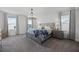 Serene main bedroom features a bed, nightstands, chandelier and natural light at 391 Cheeota Ct, Minneola, FL 34715