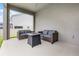 Covered back patio with outdoor seating and fire pit with view of backyard and fence at 391 Cheeota Ct, Minneola, FL 34715