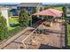 Community playground with swings, slides, and climbing structures under a shaded canopy at 391 Cheeota Ct, Minneola, FL 34715