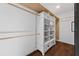 Custom closet design with white shelving and drawers for optimal storage solutions and organization at 4219 Magnolia Ave, Leesburg, FL 34748